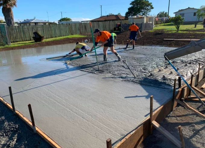 Workers leveling concrete floor — Concreting Services Toowoomba, QLD