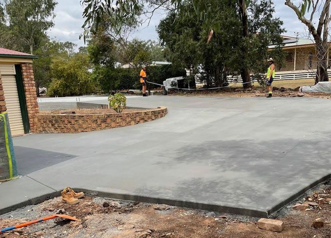 Man Holding Rope On Cemented Driveway — Concreting Services Toowoomba, QLD