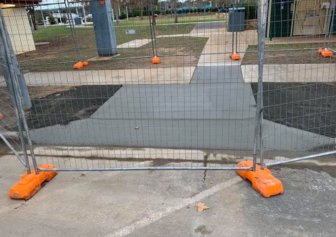 Newly Cemented Path With Metal Fence — Concreting Services Toowoomba, QLD